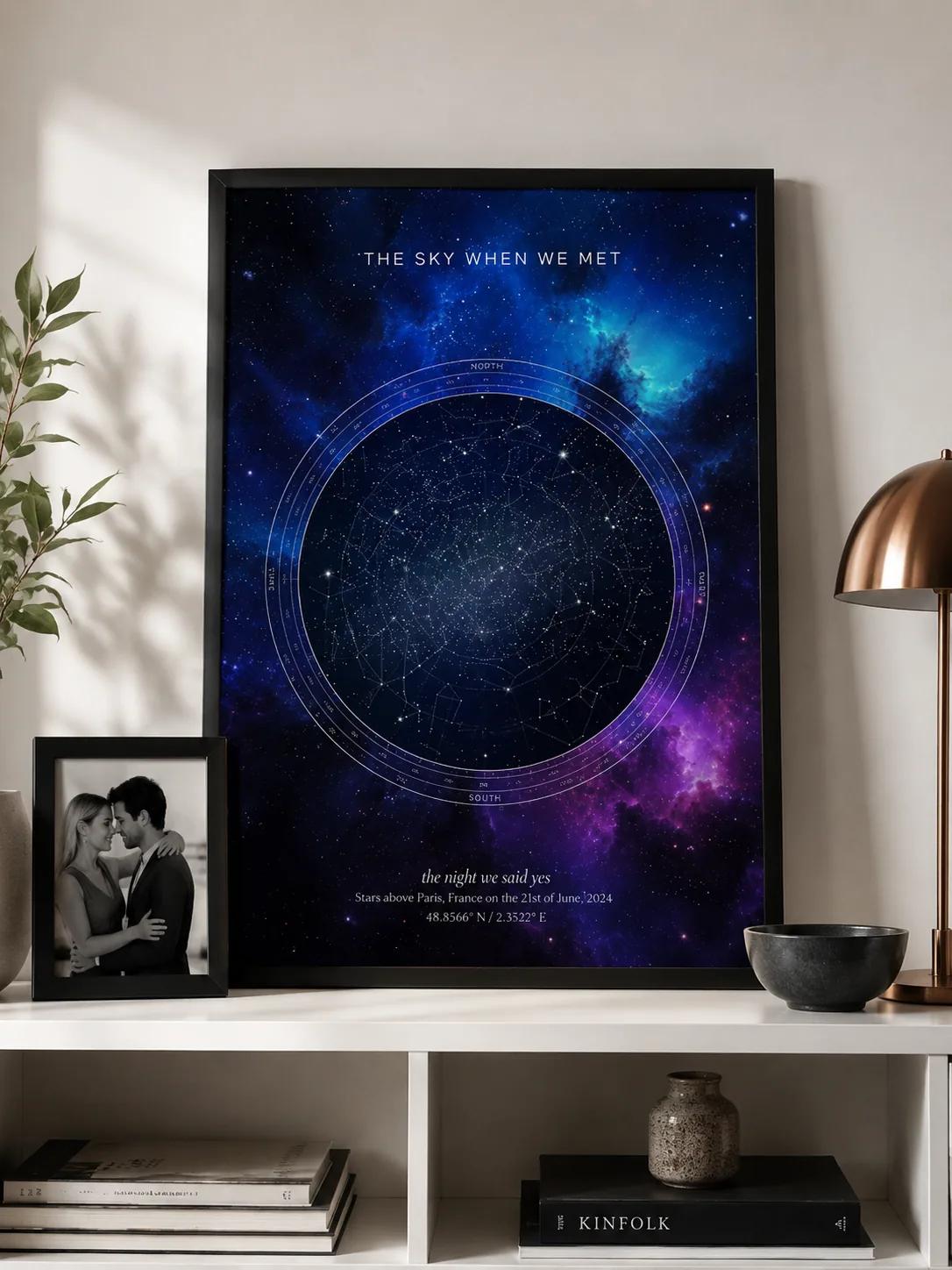 Black-framed night sky star map print above a sideboard